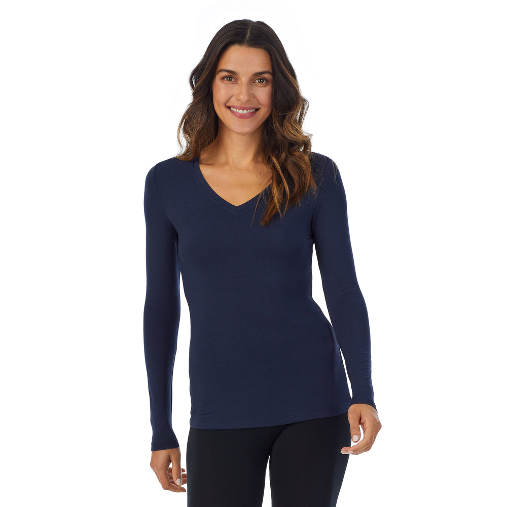 A lady wearing navy blazer long sleeve v-neck tall softwear with stretch top.