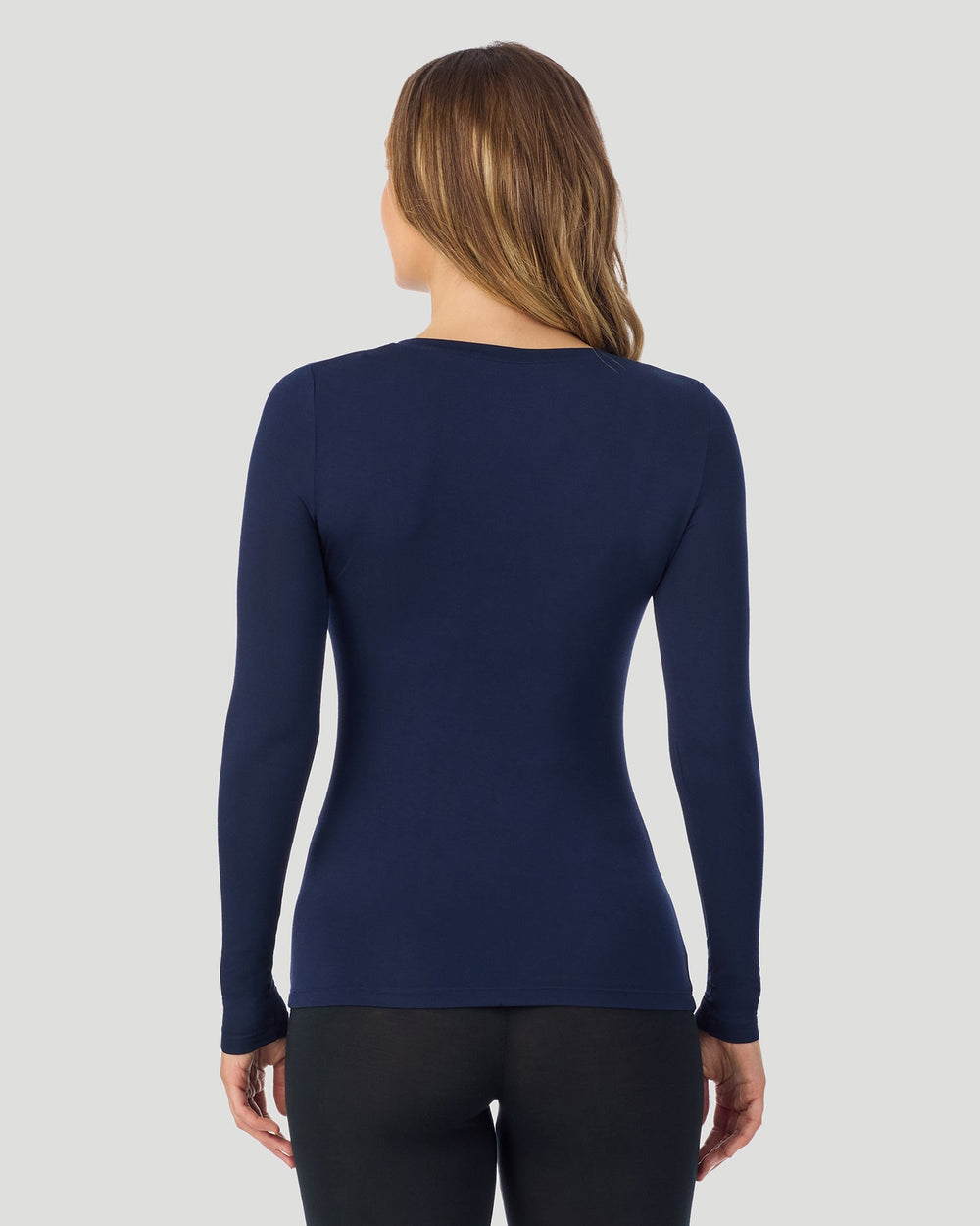 A lady wearing a black stretch legging tall.