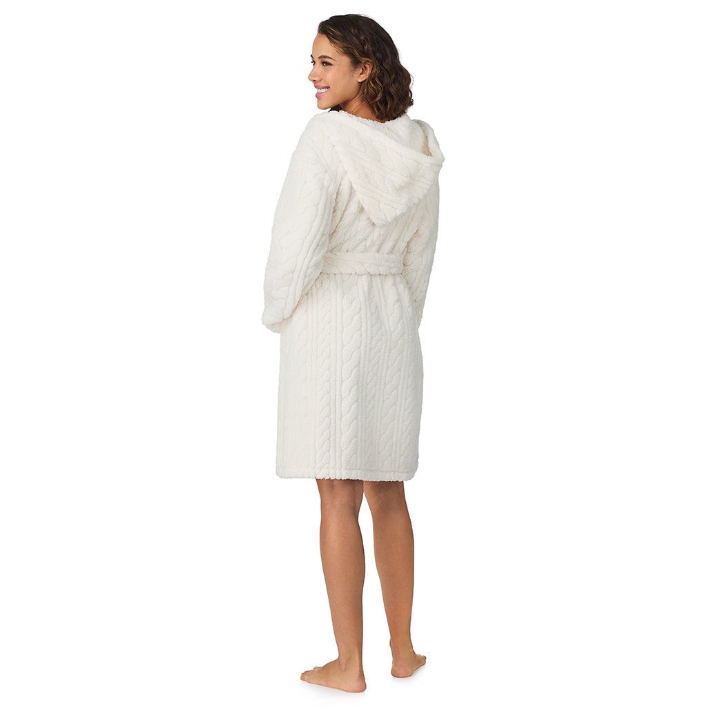 A lady wearing Ivory Cable Jacquard Sherpa Wrap Robe with Hood