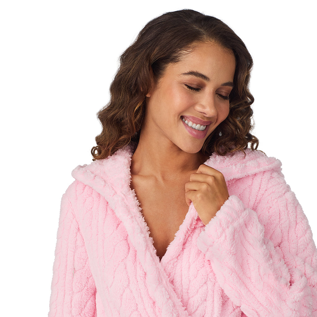 A lady wearing Powder Pink Cable Jacquard Sherpa Wrap Robe with Hood