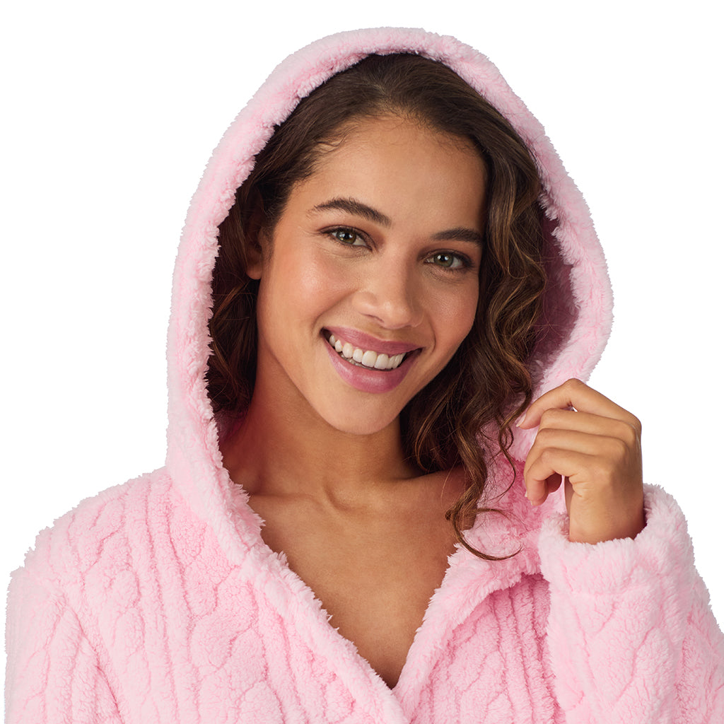 A lady wearing Powder Pink Cable Jacquard Sherpa Wrap Robe with Hood