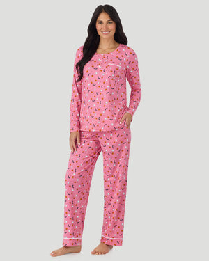 A lady wearing Cotton-Blend Long Sleeve Top and Long Pant Pajama Set in Pink Halloween