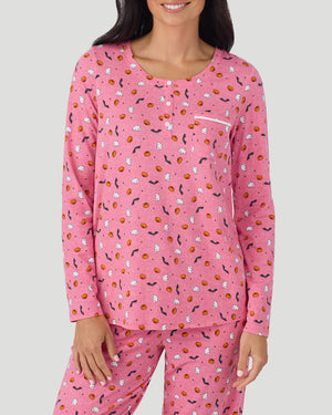 A lady wearing Cotton-Blend Long Sleeve Top and Long Pant Pajama Set in Pink Halloween closer look