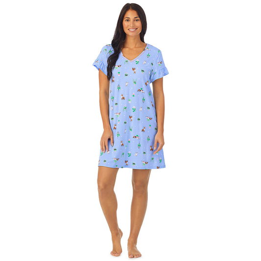 A lady wearing blue short sleeve sleepshirt with Succulent Dogs print