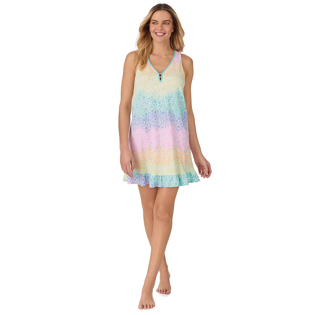 Rainbow star; Model is wearing size S. She is 5’10”, Bust 34”, Waist 26", Hips 38”.@ A lady wearing navy sleeveless cotton blend chemise with rainbow star print.