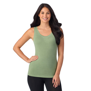 A lady wearing hedge green sleeveless reversible tank.
