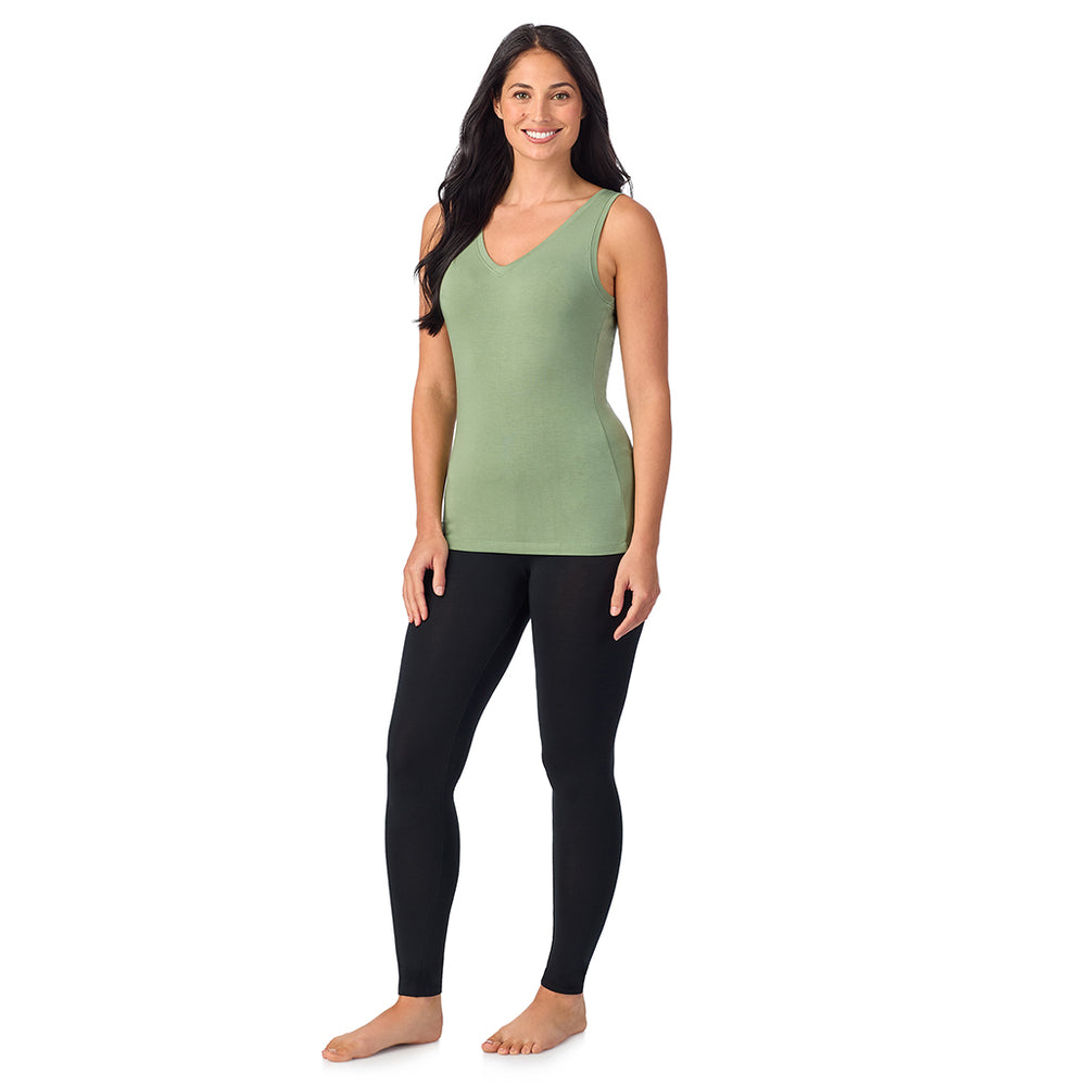 A lady wearing hedge green sleeveless reversible tank.