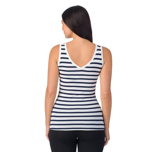 A lady wearing navy white stripe sleeveless reversible tank.