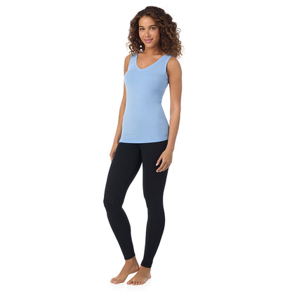 Vista Blue; Model is wearing size S. She is 5’9”, Bust 34”, Waist 23”, Hips 35”. @A lady wearing vista blue sleeveless reversible tank.