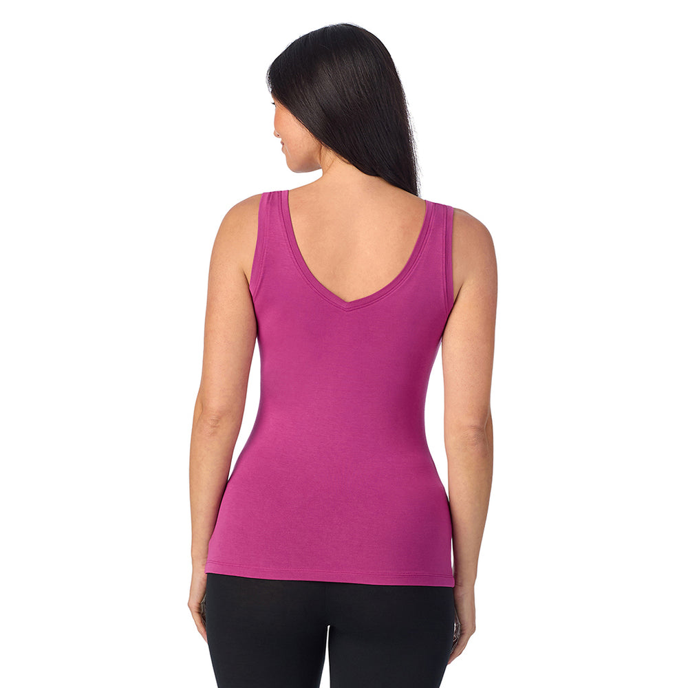 A lady wearing baton Rouge sleeveless reversible tank.
