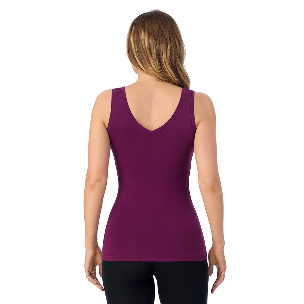 A lady wearing dark purple Rouge sleeveless reversible tank.