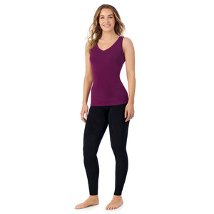 A lady wearing dark purple Rouge sleeveless reversible tank.