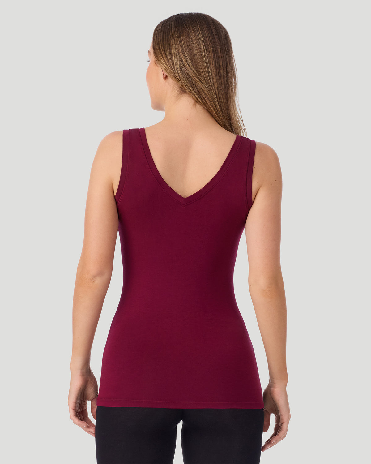 Bordeaux; Model is wearing a size S. She is 5’11.5”, Bust 34”, Waist 27”, Hips 38.5”.  @A lady wearing Bordeaux Softwear With Stretch Reversible Tank in a back view pose