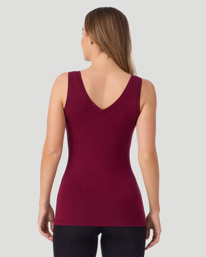 A lady wearing a ivory long sleeve stretch crew PETITE.