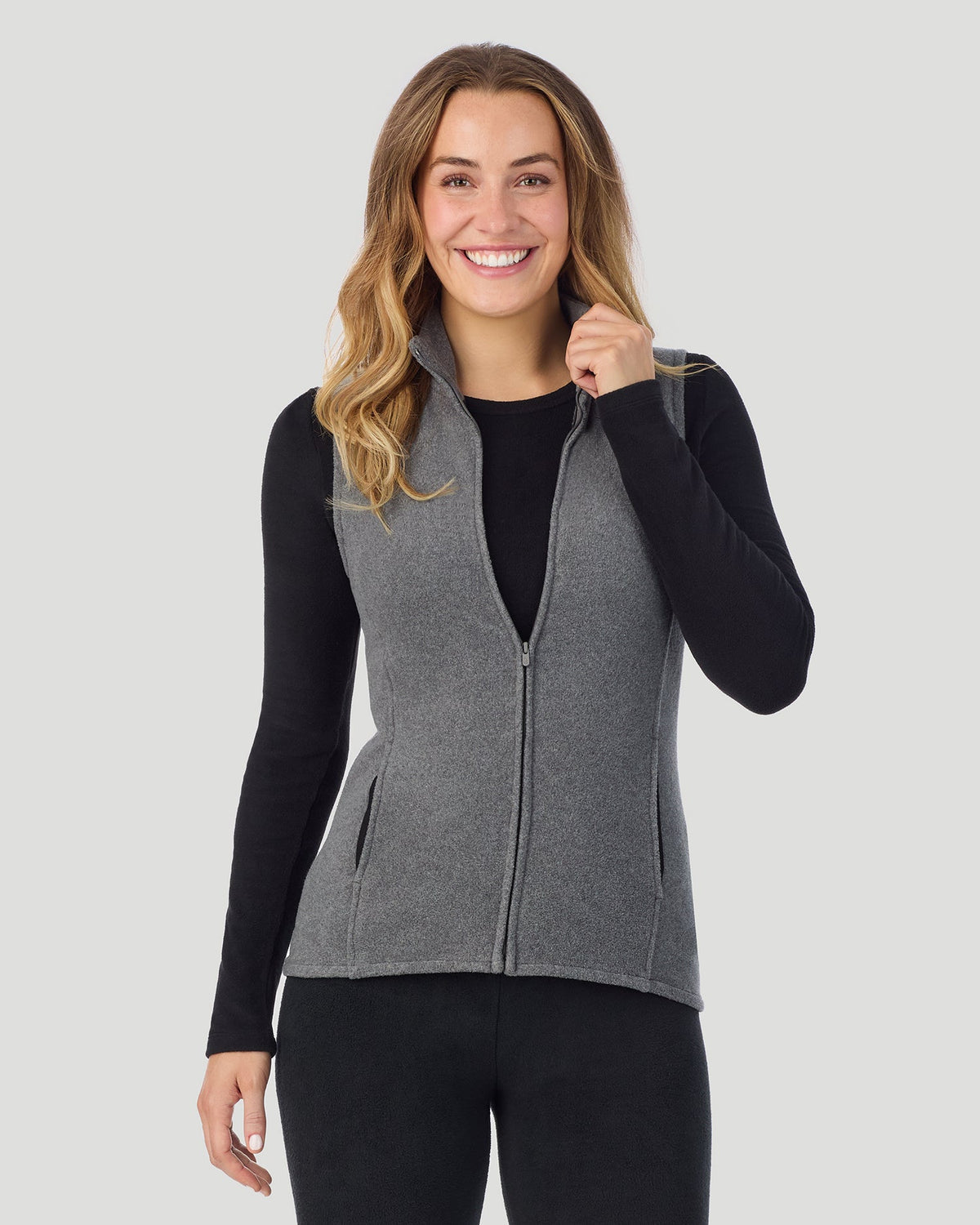A lady wearing Fleecewear with Stretch Vest in Charcoal Heather close up close up