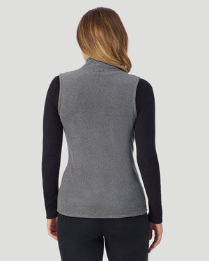 A lady wearing Fleecewear with Stretch Vest in Charcoal Heather back view back view