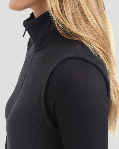 A lady wearing Fleecewear with Stretch Vest in Black close up close up