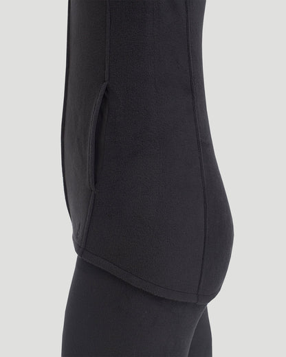 A lady wearing Fleecewear with Stretch Vest in Black back view back view