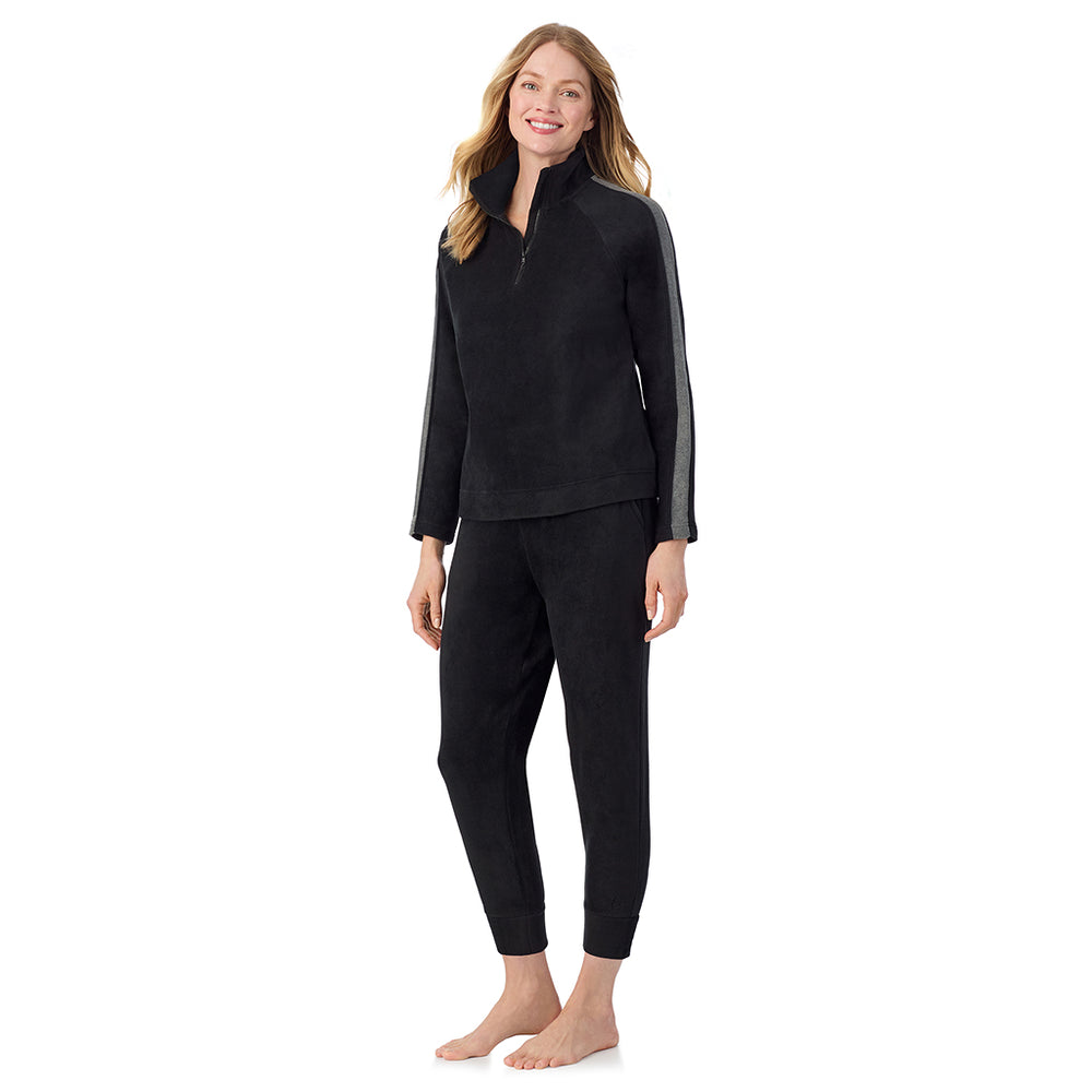 A lady wearing Black Cuddl Duds x Jennifer Lake Fleecewear with Stretch Half-Zip Pullover