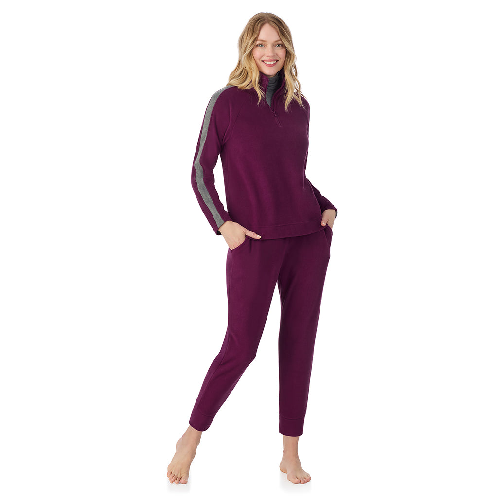 Dark Purple; Model is wearing size S. She is 5'11", Bust 33", Waist 24", Hips 34".@A lady wearing  Dark Purple Cuddl Duds x Jennifer Lake Fleecewear with Stretch Half-Zip Pullover 
