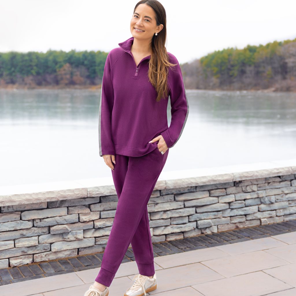 A lady wearing  Dark Purple Cuddl Duds x Jennifer Lake Fleecewear with Stretch Half-Zip Pullover 
