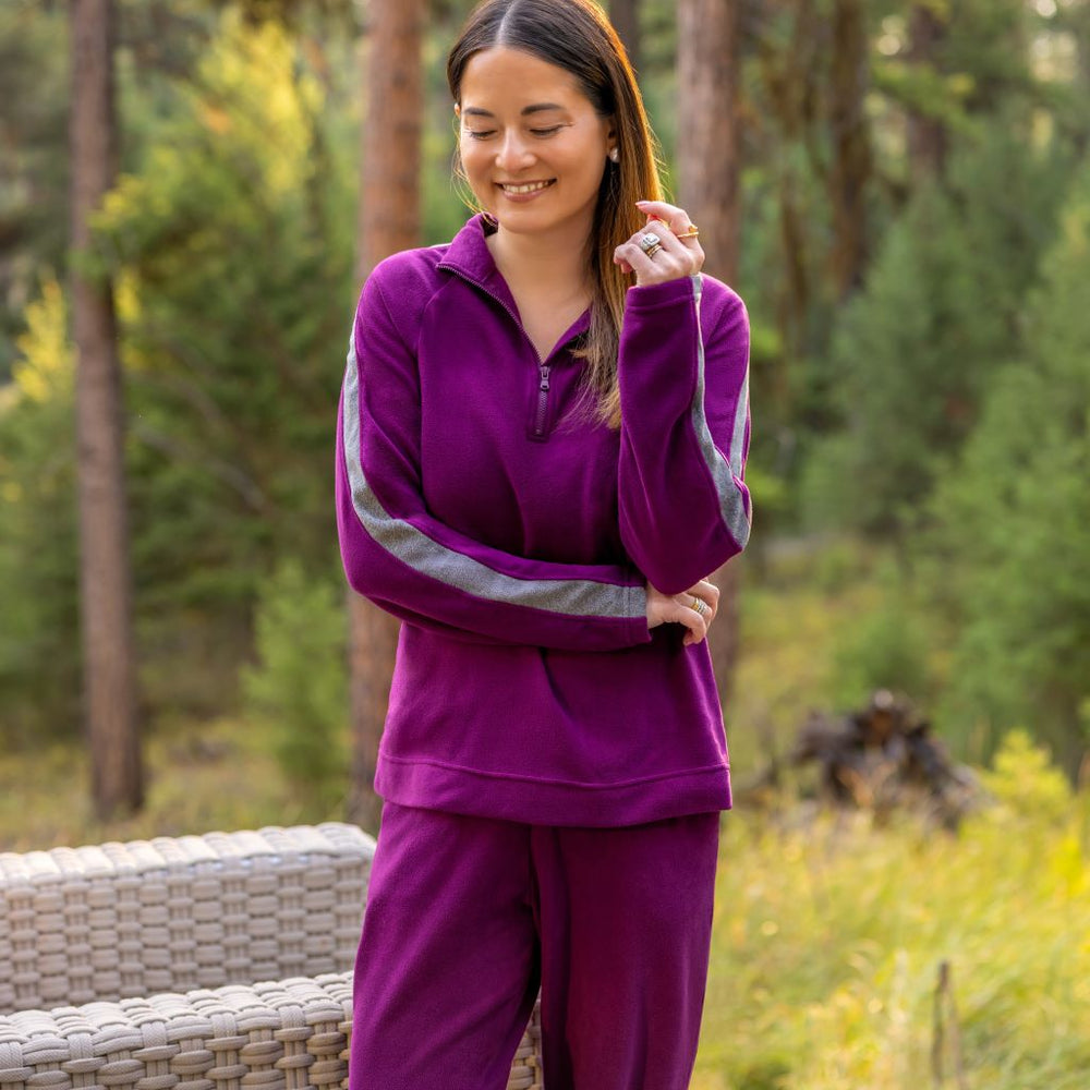 A lady wearing  Dark Purple Cuddl Duds x Jennifer Lake Fleecewear with Stretch Half-Zip Pullover