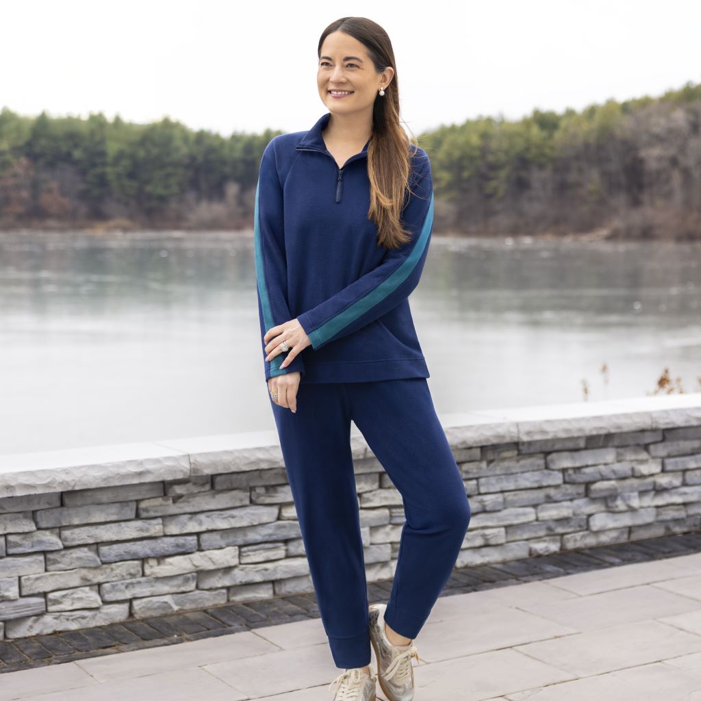 A lady wearing NAvy Blazer Cuddl Duds x Jennifer Lake Fleecewear with Stretch Half-Zip Pullover 