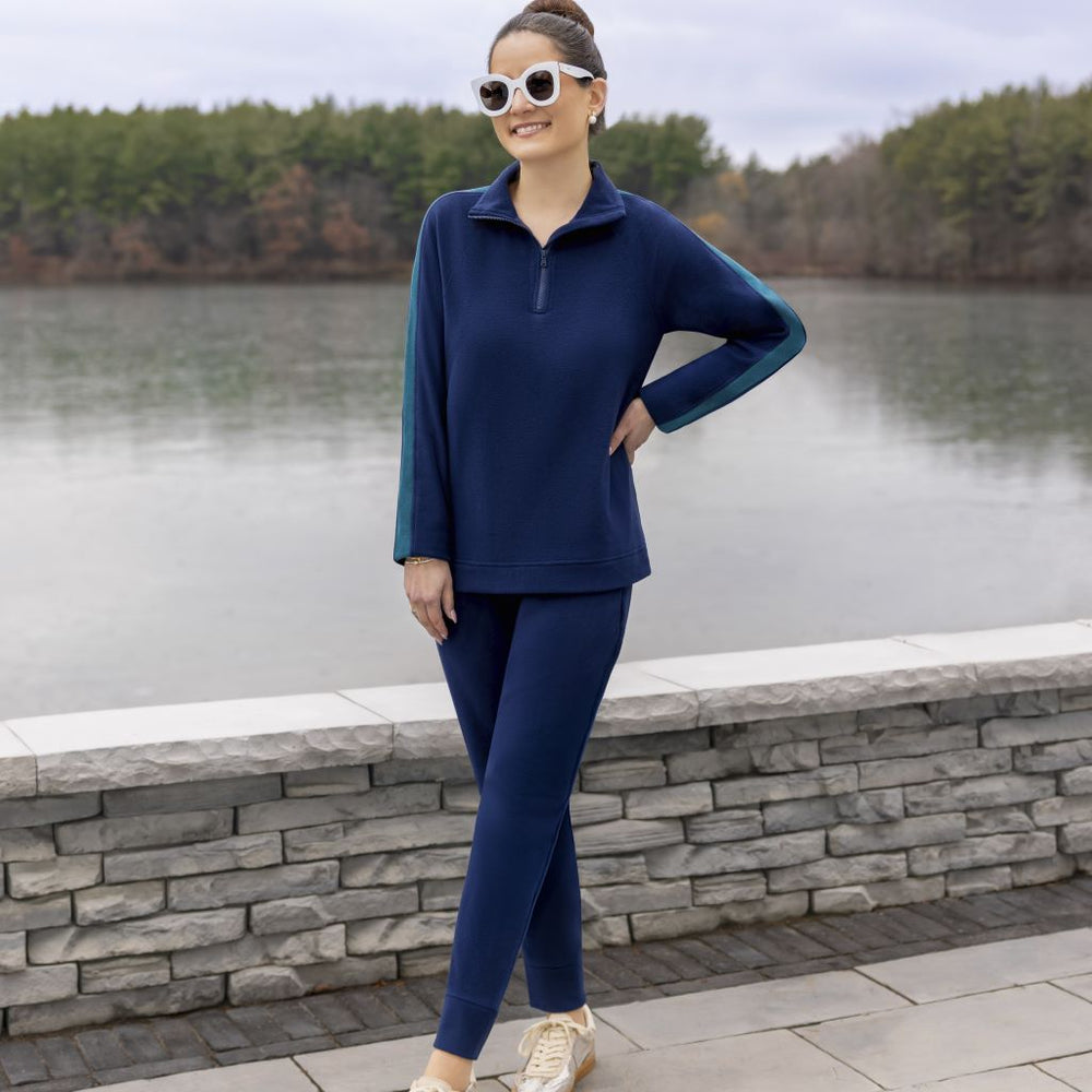 A lady wearing NAvy Blazer Cuddl Duds x Jennifer Lake Fleecewear with Stretch Half-Zip Pullover