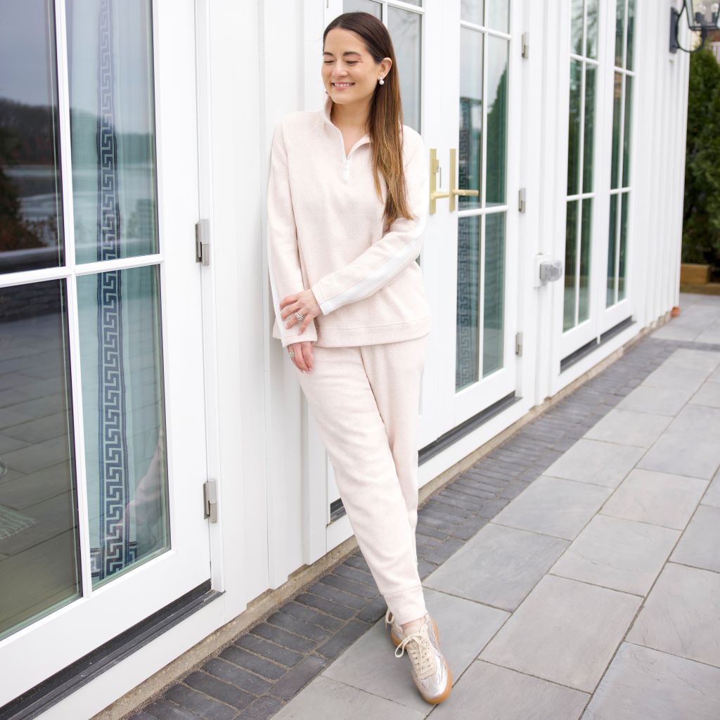 A lady wearing Oatmeal Heather Cuddl Duds x Jennifer Lake Fleecewear with Stretch Half-Zip Pullover 