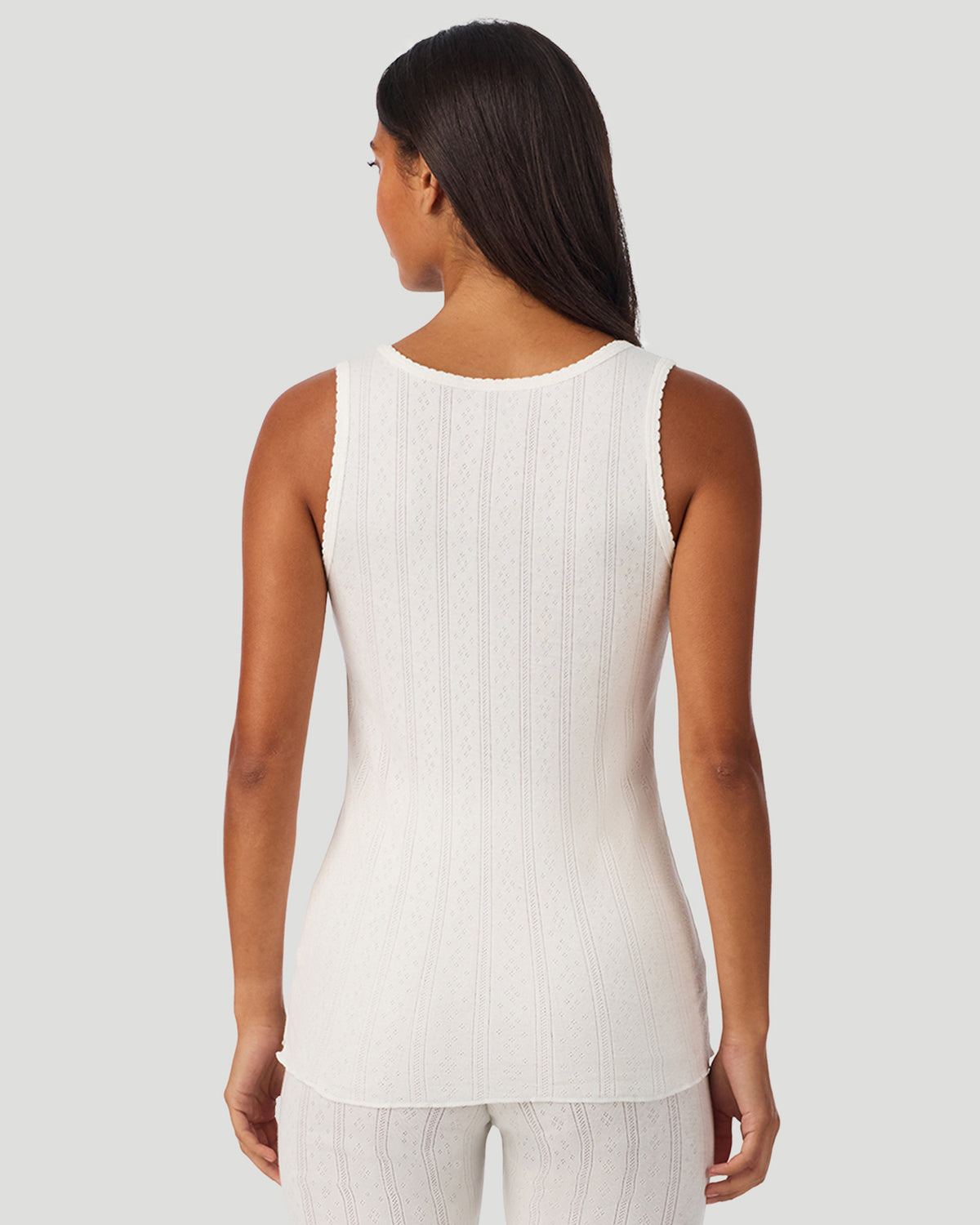  A lady wearing Ivory Cotton Pointelle Tank in a back view closer look
