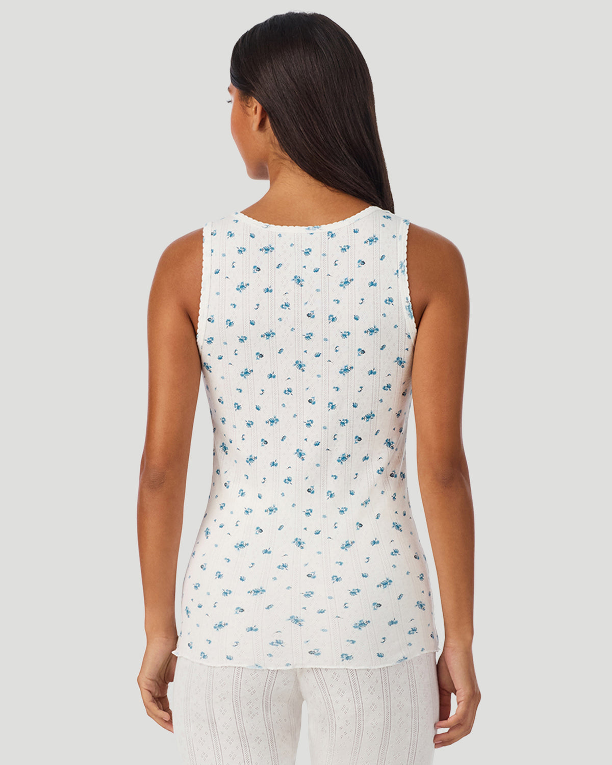 Blue Ditsy; Model is wearing a size S. She is 5’7”, Bust 32”, Waist 25”, Hips 34”.  @ A lady wearing Blue Ditsy Cotton Pointelle Tank in a back view closer look