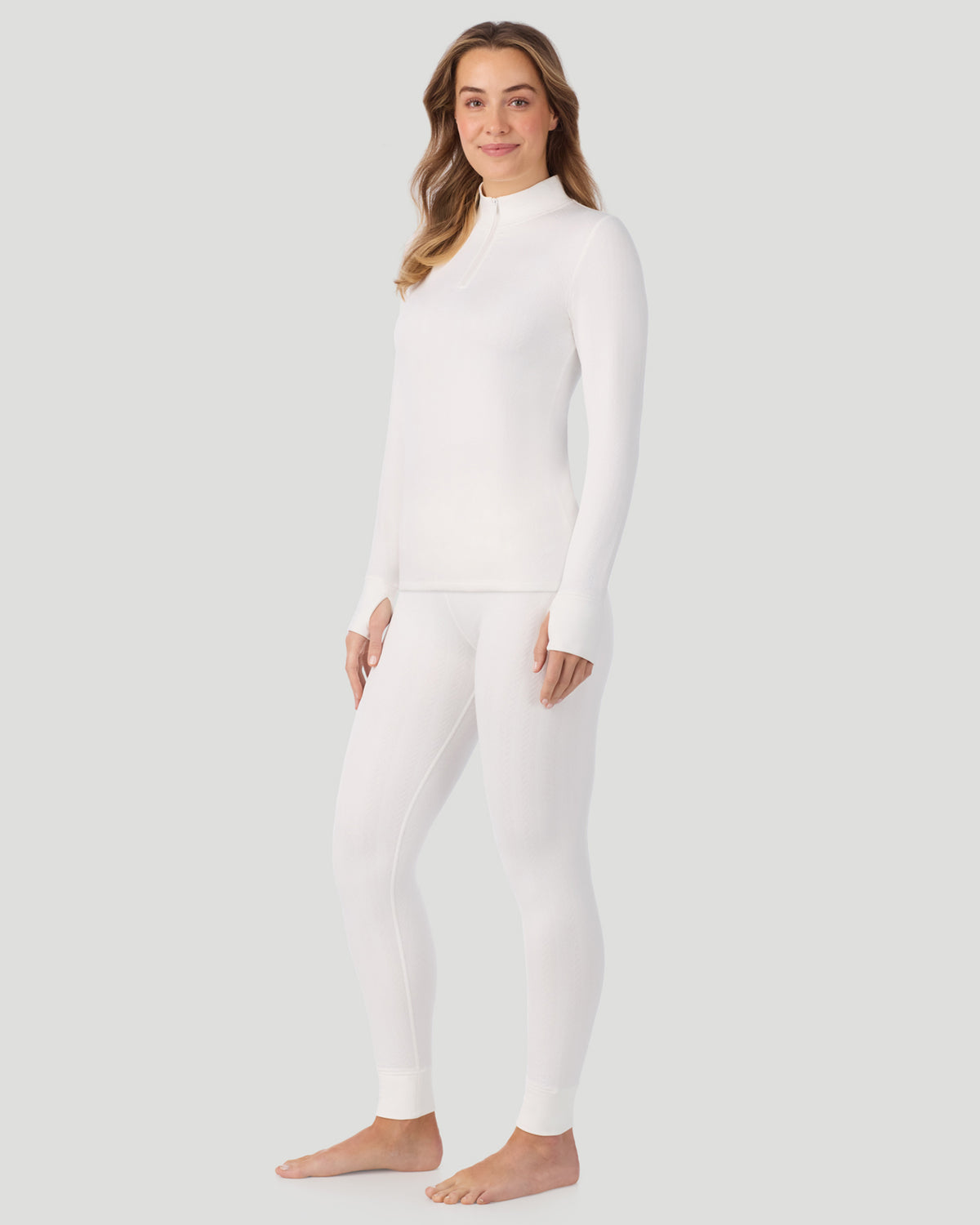 Ivory; Model is wearing a size S. She is 5’11.5”, Bust 34”, Waist 27”, Hips 38.5”. @ A lady wearing Cozy Cable Long Sleeve Quarter Zip Top in Ivory 