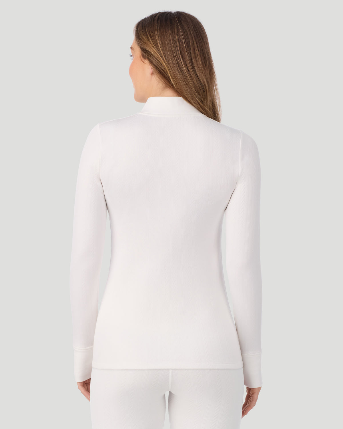  A lady wearing Cozy Cable Long Sleeve Quarter Zip Top in Ivory back view
