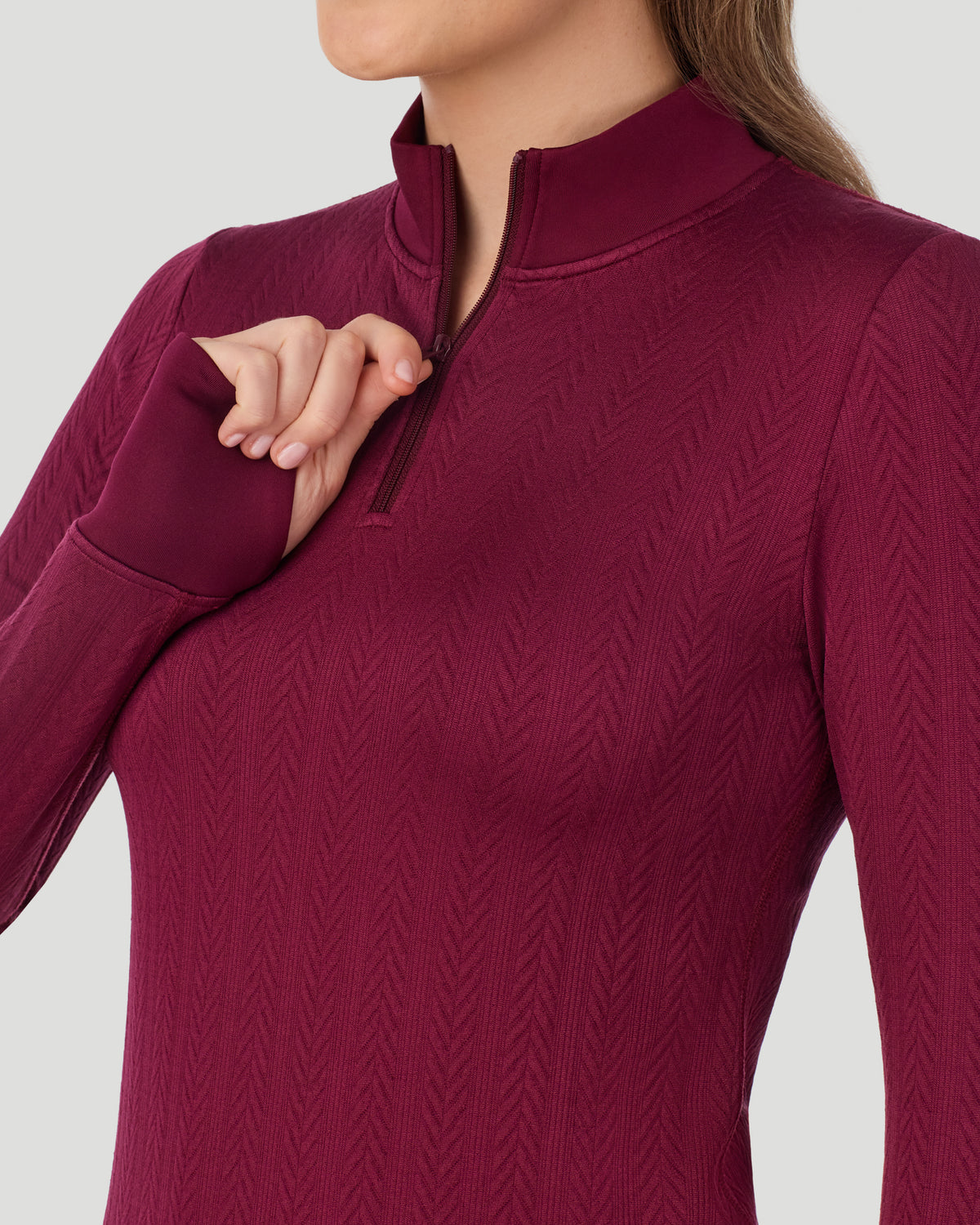  A lady wearing Cozy Cable Long Sleeve Quarter Zip Top in Bordeaux closer look at neck