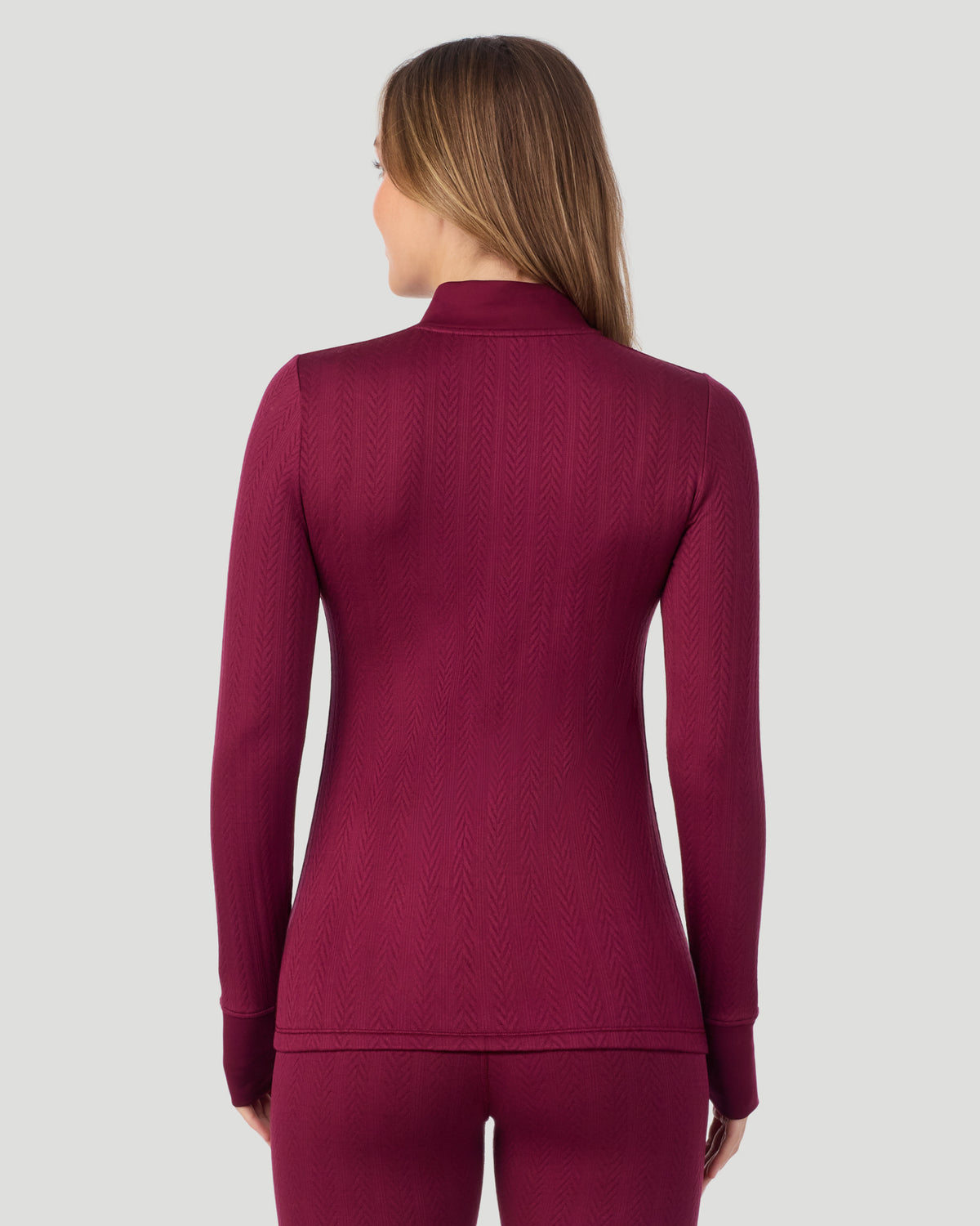  A lady wearing Cozy Cable Long Sleeve Quarter Zip Top in Bordeaux back view