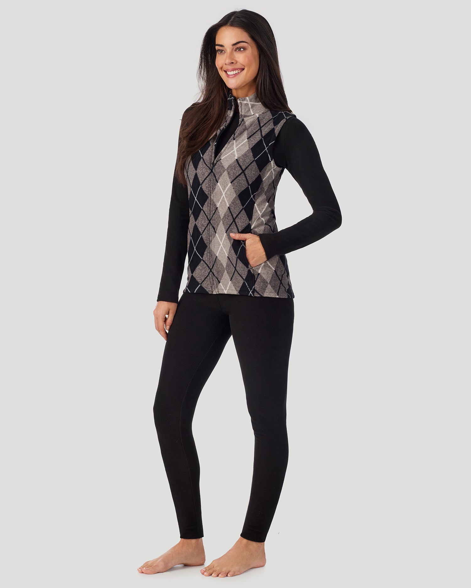 A lady wearing Fleecewear with Stretch Vest in Charcoal Argyle