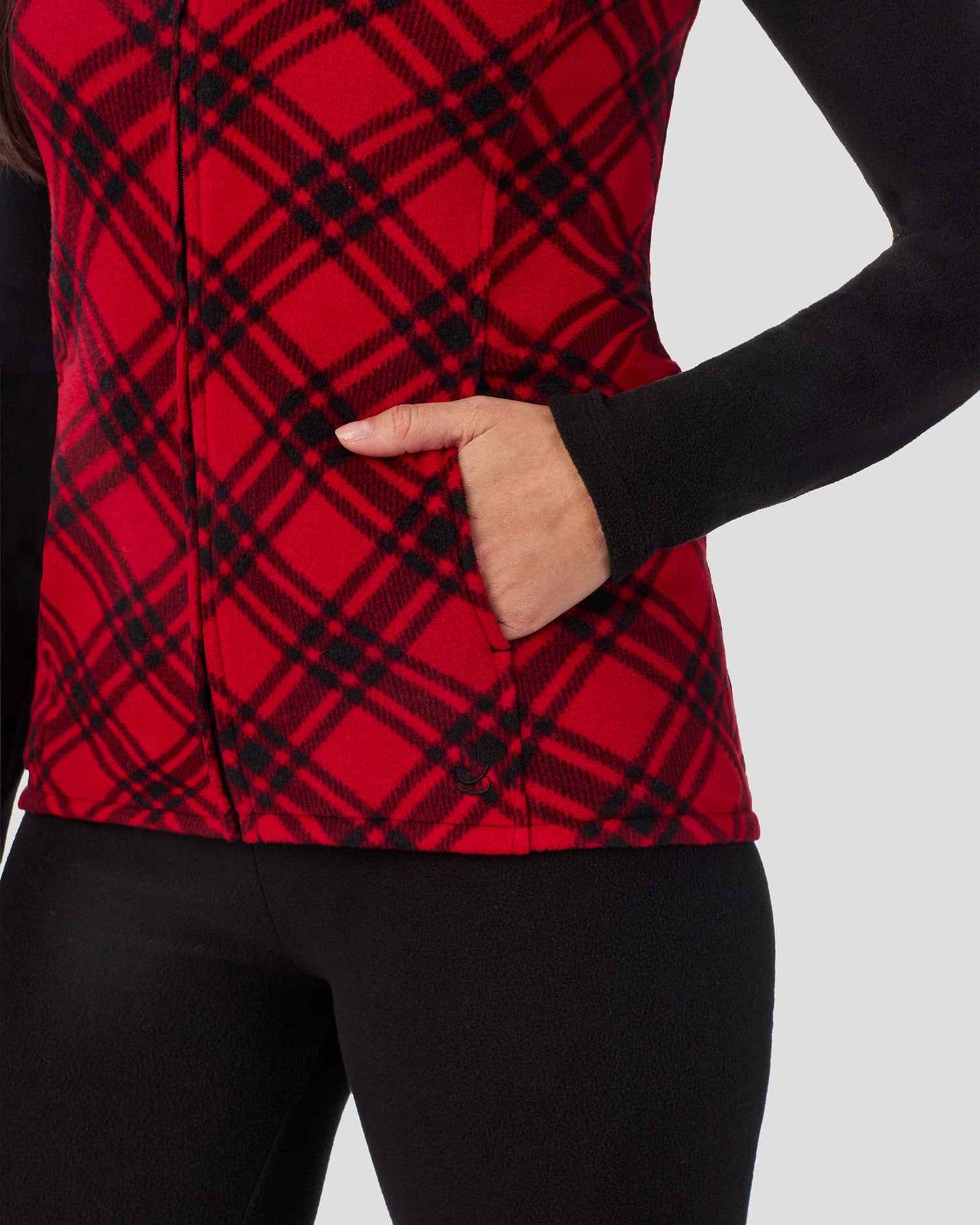 A lady wearing Fleecewear with Stretch Vest in Red White Bias Plaid