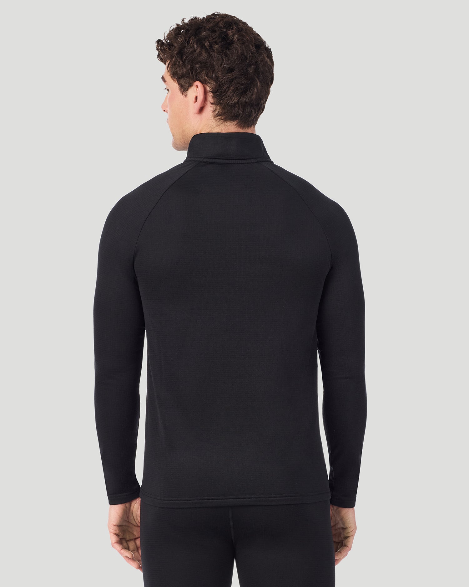Black; Model is wearing a size M. He is 6’2”, Waist is 32”, Inseam 32”. @ A man wearing Black X Fleece Quarter Zip in a front view pose