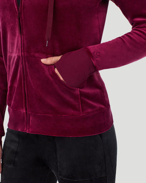 A lady wearing Stretch Velour Full Zip Hoodie in Bordeaux shown in a front view detail close up shot