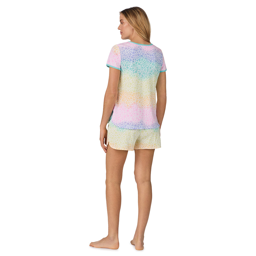 Rainbow Star;Model is wearing size S. She is 5’10”, Bust 34”, Waist 26", Hips 38”.@ A lady wearing sleeve top with short pajama set with rainbow star print