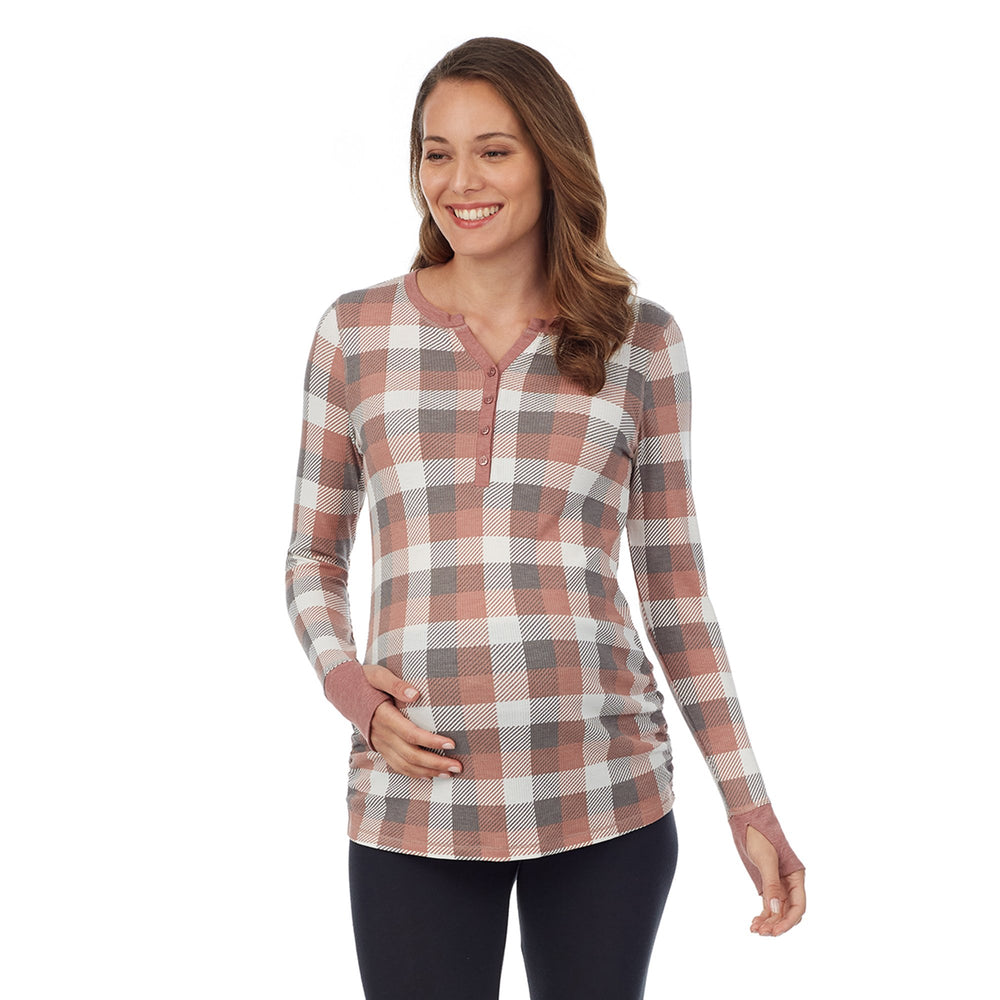 A lady wearing taupe grey buffalo check long sleeves stretch thermal maternity split v-neck henley.#Model is wearing a maternity bump.