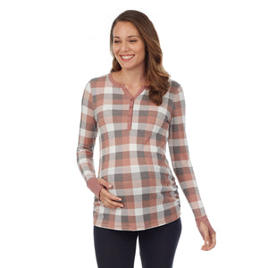 A lady wearing taupe grey buffalo check long sleeves stretch thermal maternity split v-neck henley.#Model is wearing a maternity bump.