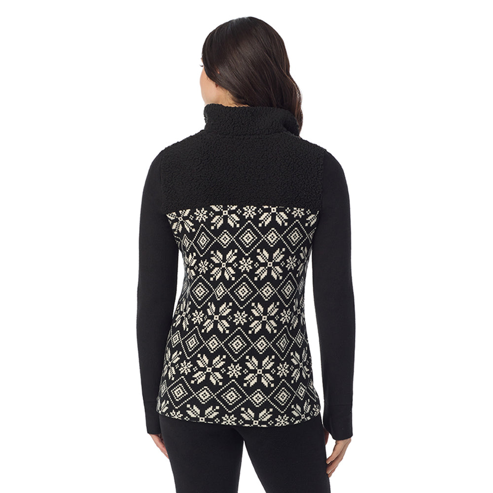 A Lady is wearing a Black White Snowflake Fleecewear With Stretch Long Sleeve Mock Neck Henley With Sherpa !94% Recycled Polyester, 6% Spandex!