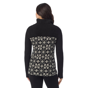  A Lady is wearing a Black White Snowflake Fleecewear With Stretch Long Sleeve Mock Neck Henley With Sherpa !94% Recycled Polyester, 6% Spandex!