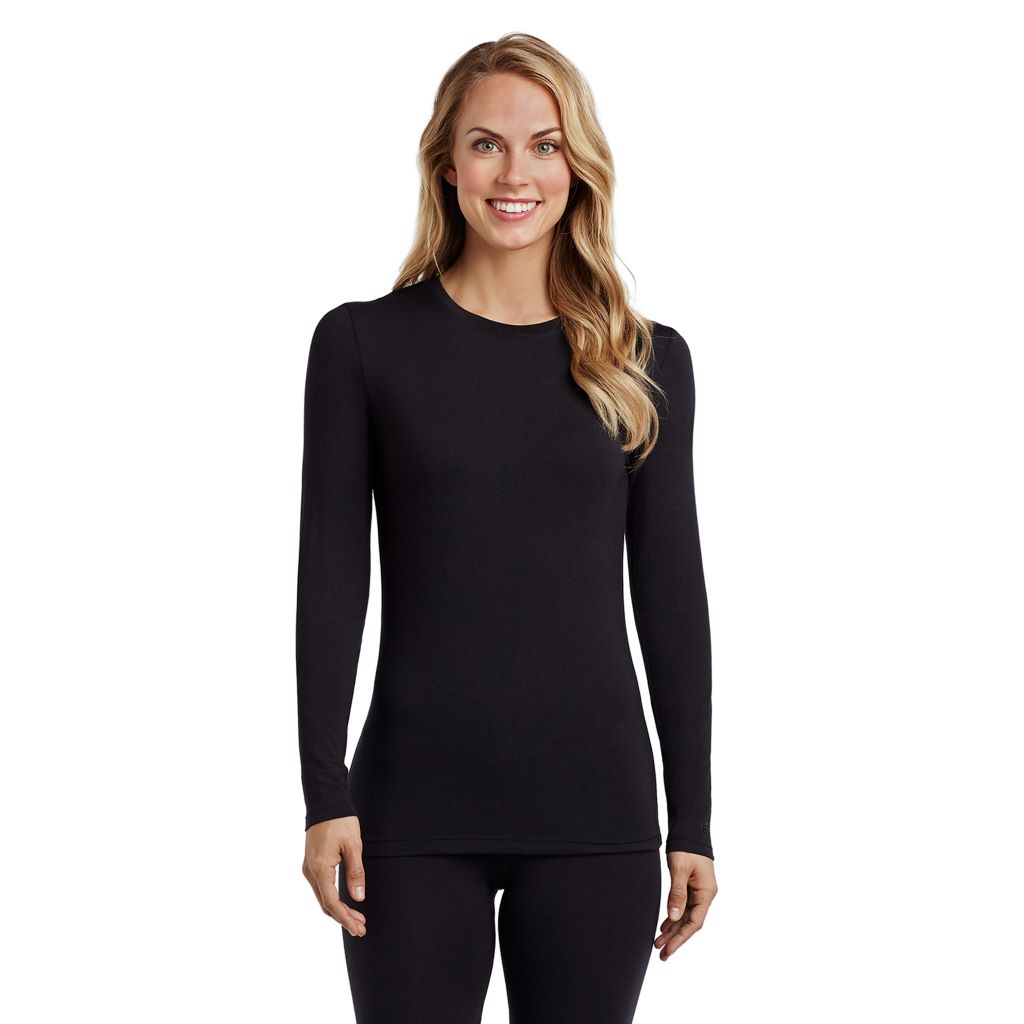 A lady wearing a black long sleeve stretch crew. 