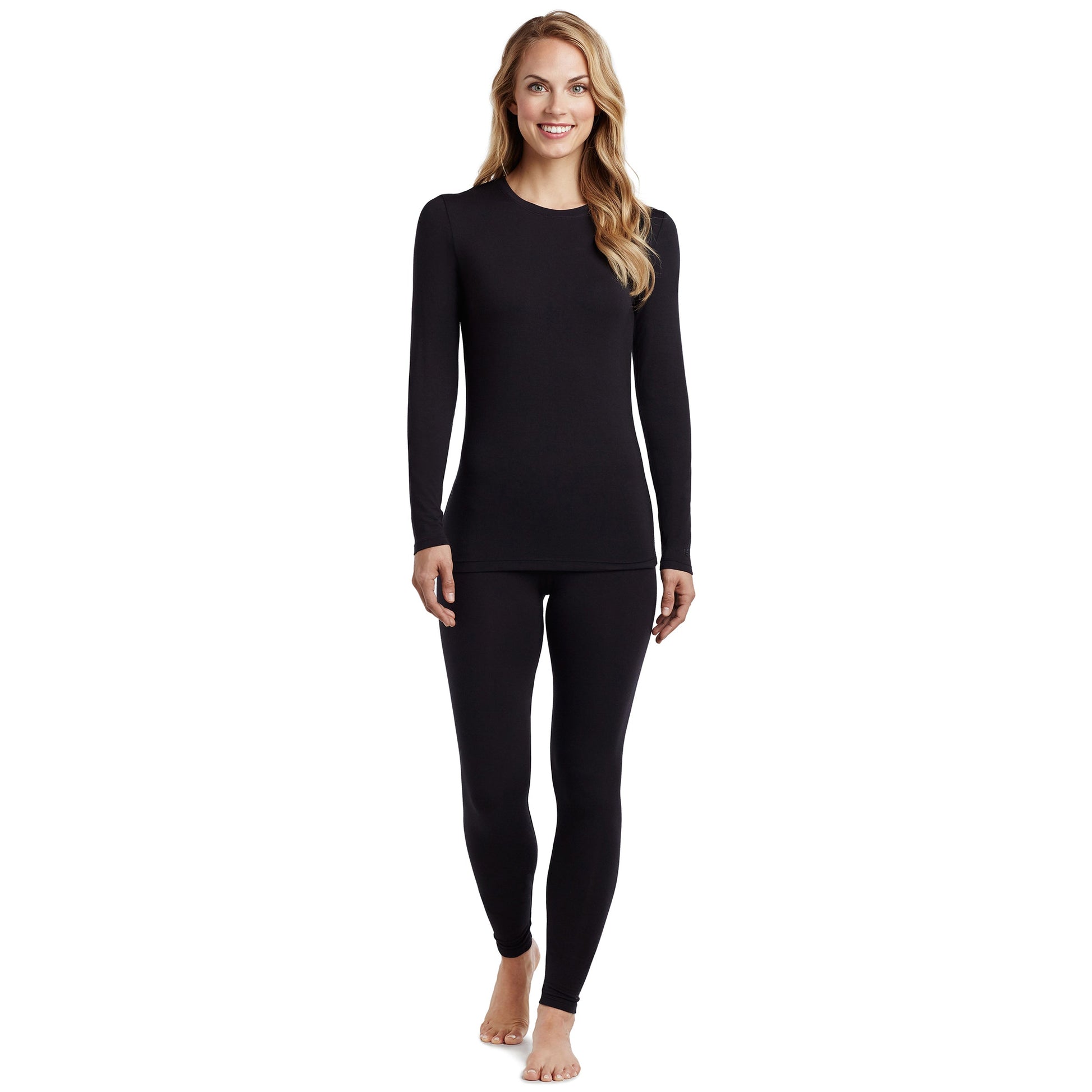 A lady wearing a black long sleeve stretch crew