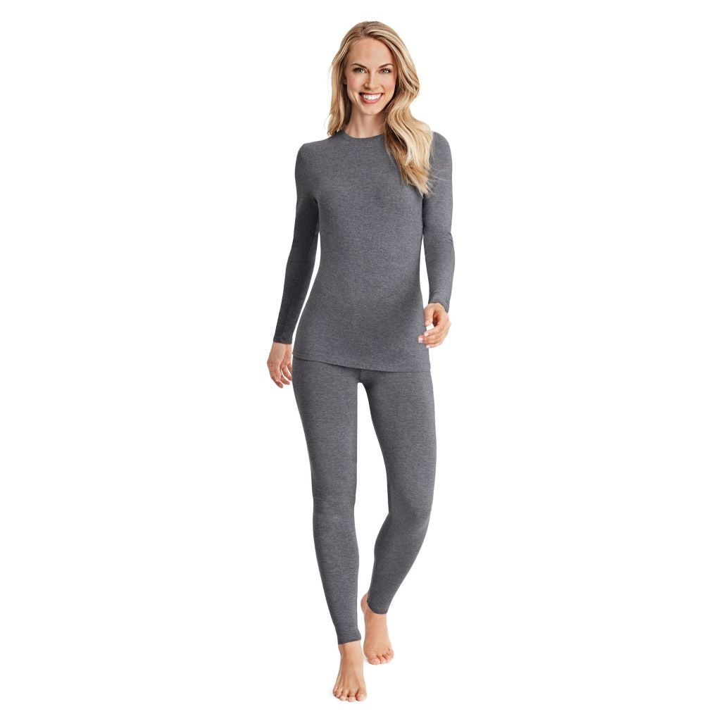 A lady wearing a charcoal heather long sleeve stretch crew.
