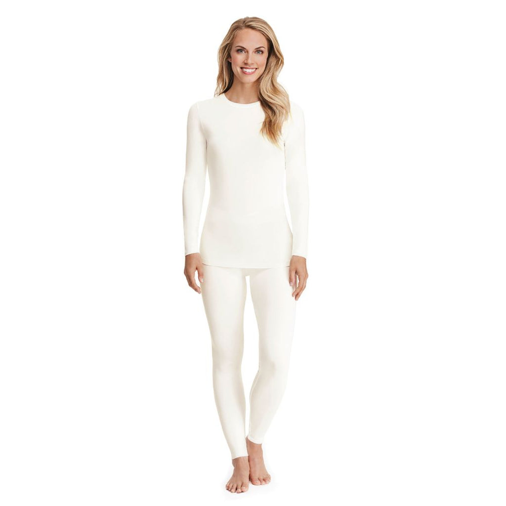 A lady wearing a ivory long sleeve stretch crew.