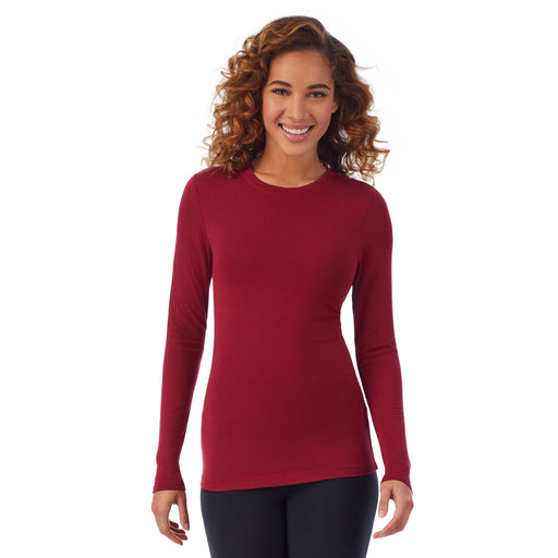 Rhubarb; Model is wearing size S. She is 5’9”, Bust 34”, Waist 23”, Hips 35”. @A lady wearing a rhubarb long sleeve stretch crew.