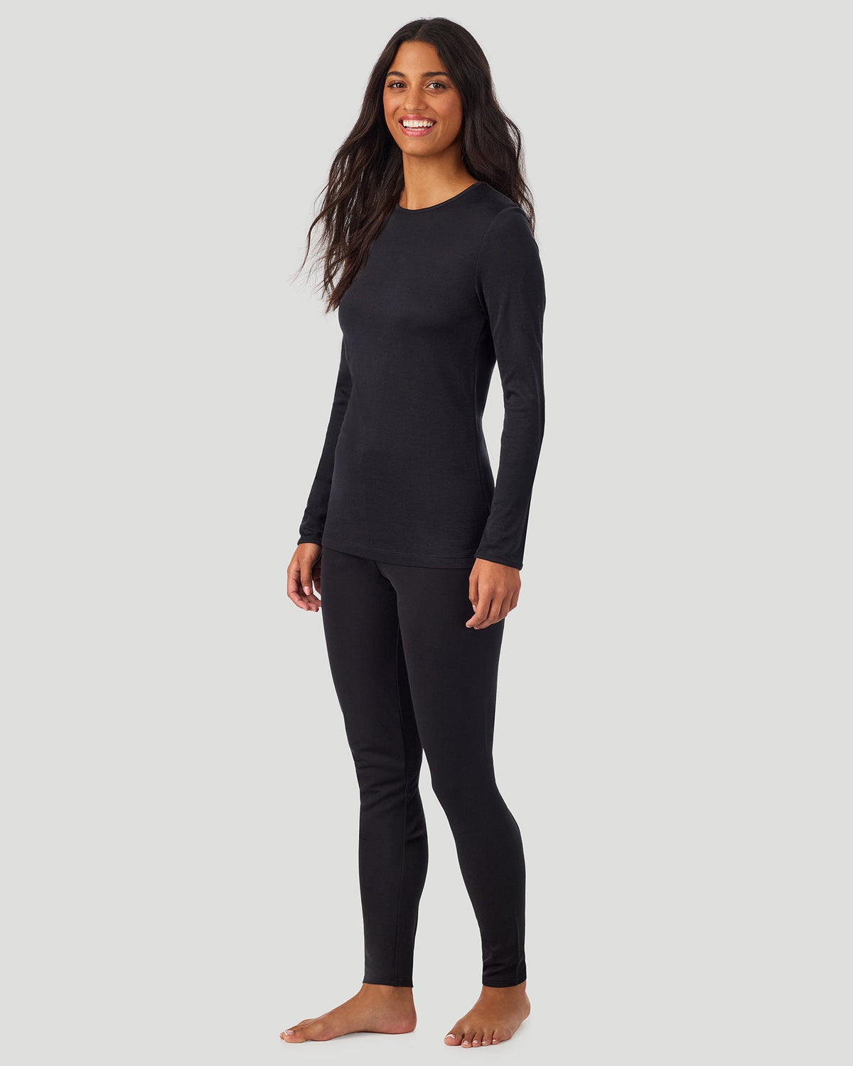 A lady wearing Softwear Long Sleeve Crew in Black side view side view
